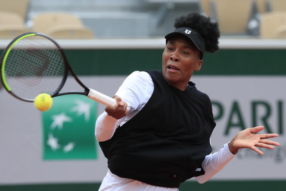 Venus Williams of the U.S. plays a shot against Slovakia's Anna Karolina Schmiedlova in the first round match of the French Open tennis tournament at the Roland Garros stadium in Paris, France, Sunday, Sept. 27, 2020. (AP Photo/Michel Euler)