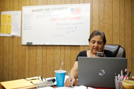 Maria Romano, an organizer for the human rights group Somos Un Pueblo Unidos, speaks on the phone in Hobbs