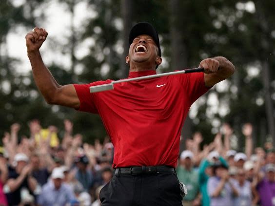Woods celebrates on the 18th (AP)