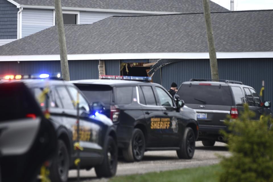 Authorities respond to the Swan Creek Boat Club after a driver crashed a vehicle through a building where a children's birthday party was taking place, Saturday, April 20, 2024, in Berlin Township, Mich. (Kathleen Kildee/Detroit News via AP)