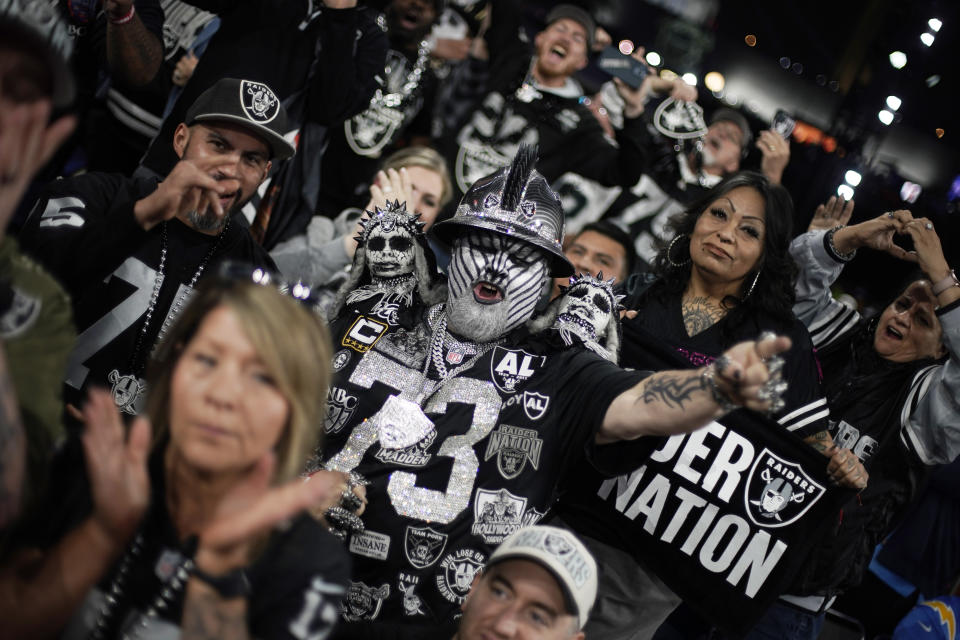 Las Vegas Raiders fans cheer during the third round of the NFL football draft, Friday, April 28, 2023, in Kansas City, Mo. (AP Photo/Charlie Riedel)