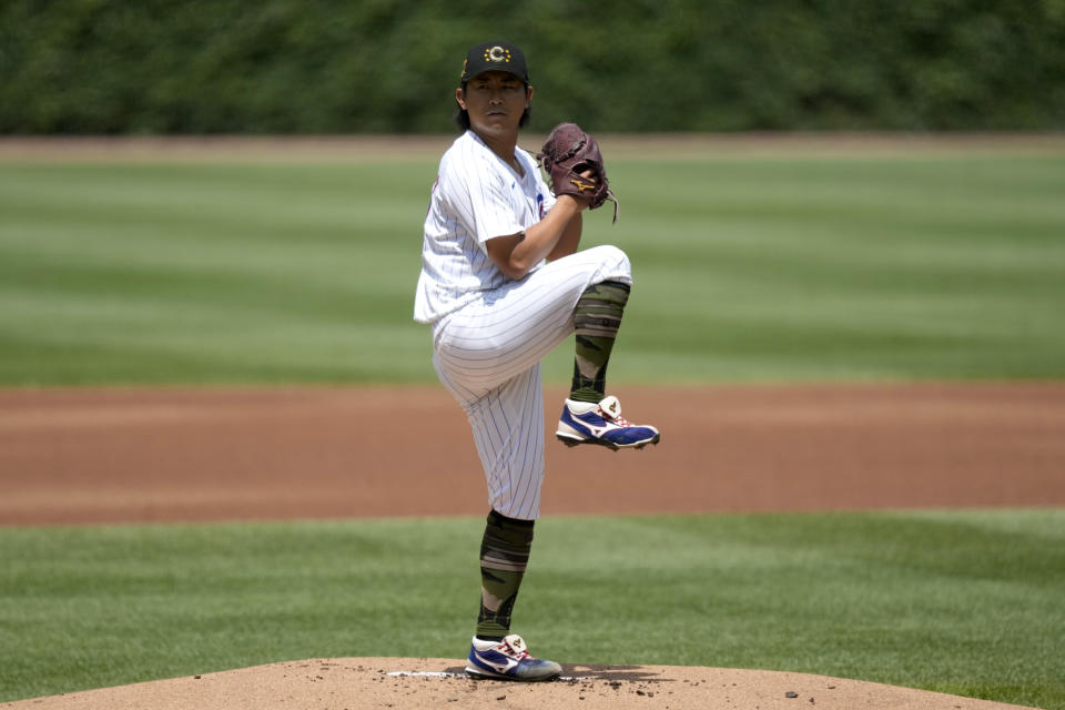 Chicago Cubs starting pitcher Shota Imanaga winds up during the first inning of a baseball game against the Pittsburgh Pirates, Saturday, May 18, 2024, in Chicago. (AP Photo/Charles Rex Arbogast)