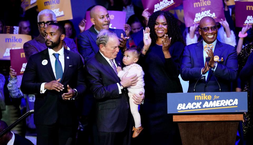 Michael Bloomberg is joined on stage by supporters for his campaign's launch of "Mike for Black America" on Feb. 13, 2020, in Texas. (David J. Phillip/ASSOCIATED PRESS)