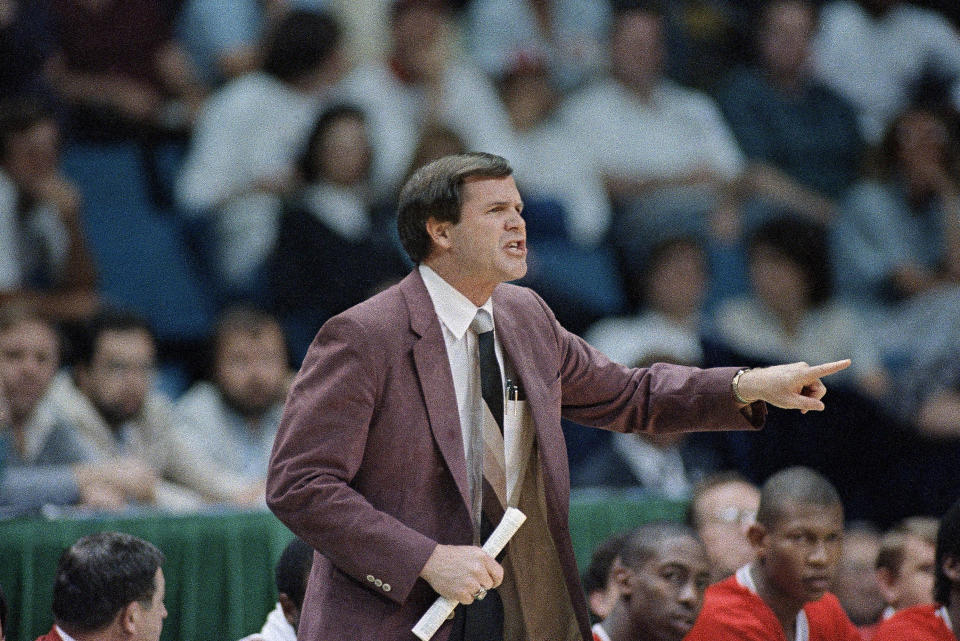 Louisville coach Denny Crum yells from the sideline during the first half of the NCAA semifinal game between Louisville and LSU at Reunion Arena, Saturday, March 29, 1986, Dallas, Tex. (AP Photo/David Longstreath)