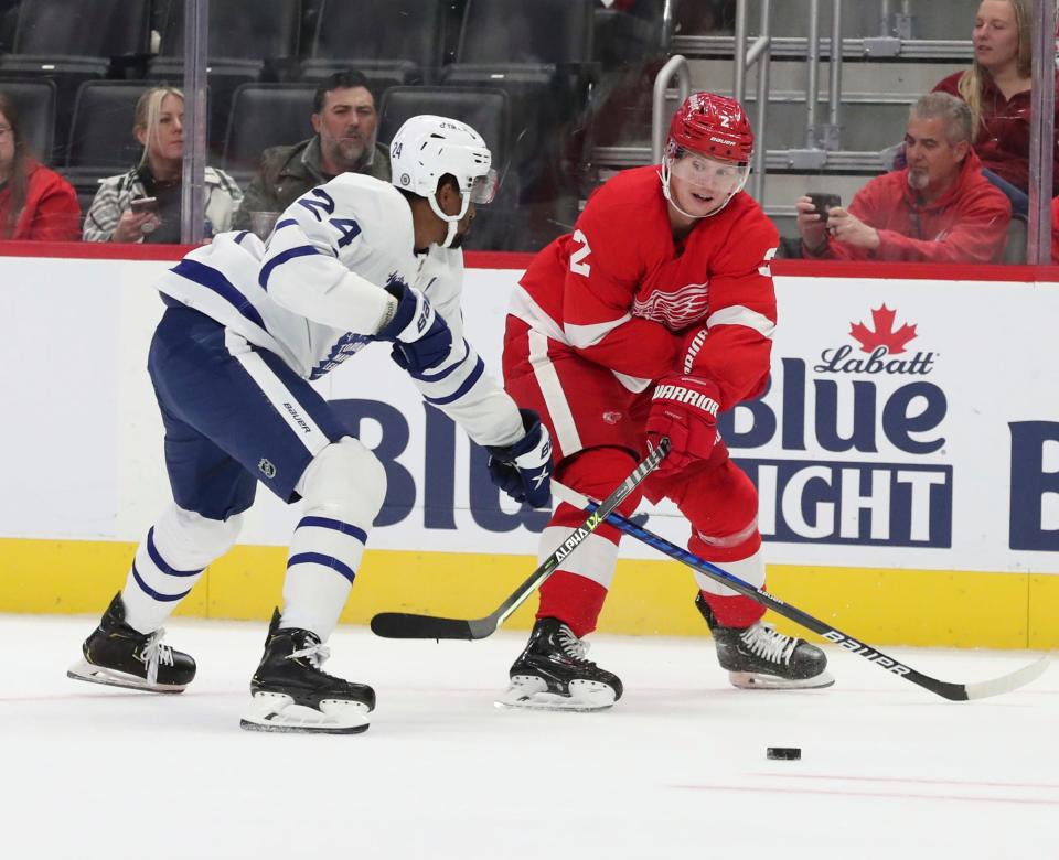 Detroit Red Wings defenseman Olli Maata (2) passes against Toronto Maple Leafs right wing Wayne Simmonds (24) during first period action Friday, October 7, 2022.