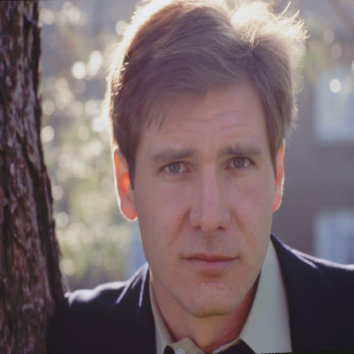 Harrison Ford leans against a tree, 1978