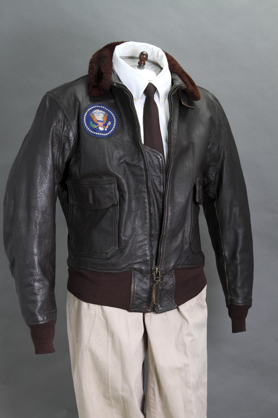 FILE - This 2012 file photo provided by John McInnis Auctioneers shows late President John F. Kennedy's Air Force One leather bomber jacket, which sold for $570,000 at an auction on Sunday, Feb. 17, 2013. The jacket is part of a collection of John F. Kennedy memorabilia from the family of David Powers, a former special assistant to the president, that fetched almost $2 million at Sunday's auction at John McInnis Auctioneers in Amesbury, Mass. (AP Photo/John McInnis Auctioneers, Matthew Bourgeois, File)