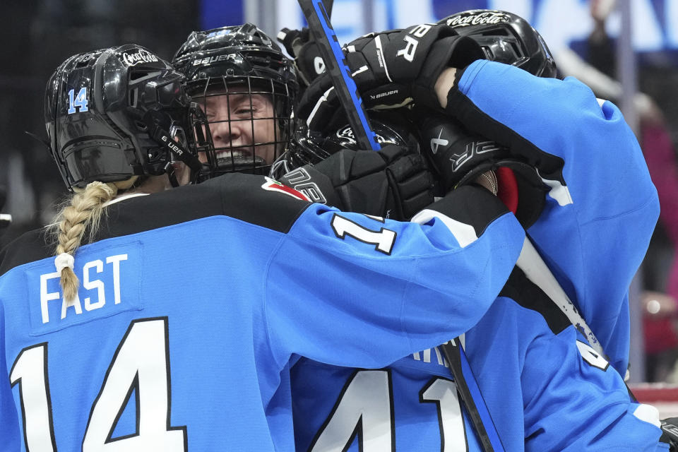 Toronto's Jesse Compher, second from left, celebrates with teammates after scoring against Montreal during the third period of a PWHL hockey game Friday, Feb. 16, 2024, in Toronto. (Chris Young/The Canadian Press via AP)