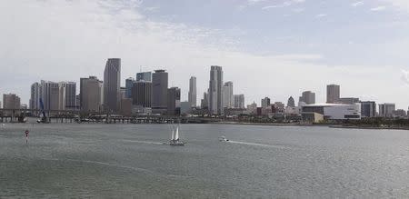 A portion of the City of Miami's skyline, along with the American Airlines Arena (R), home of the NBA's Miami Heat, is seen near the Port of Miami in Miami, Florida, May 2, 2014. REUTERS/Andrew Innerarity