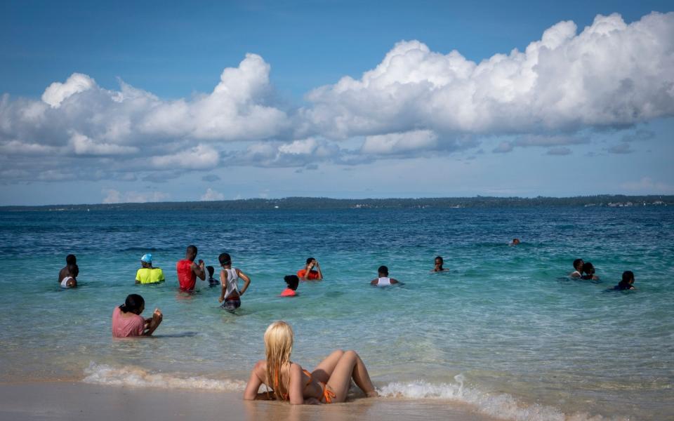 Tourists mix with locals on Zanzibar's beaches