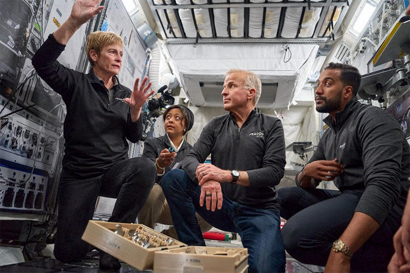 Whitson, left, briefs her crewmates on the intricacies of living and working in space. / Credit: Axiom Space