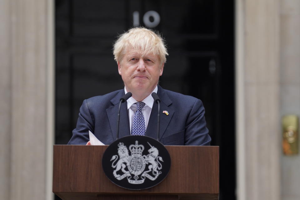 Prime Minister Boris Johnson reads a statement outside 10 Downing Street in London.