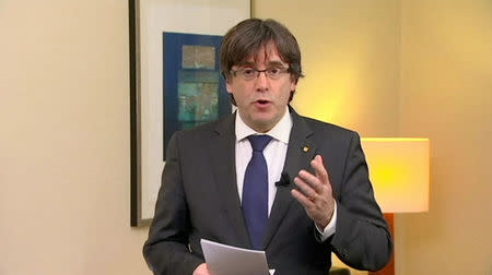 Sacked Catalan President Carles Puigdemont makes a statement in this still image from video calling for the release of "the legitimate government of Catalonia", after a Spanish judge ordered nine Catalan secessionist leaders to be held in custody pending a potential trial over the region's independence push, in Brussels, Belgium, November 2, 2017. TV3 via REUTERS