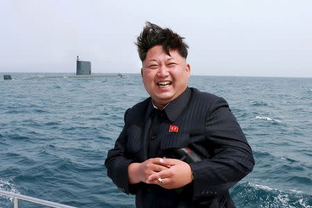 North Korean leader Kim Jong Un watches the test-fire of a strategic submarine underwater ballistic missile (not pictured), in this undated photo released by North Korea's Korean Central News Agency (KCNA) in Pyongyang on May 9, 2015. REUTERS/KCNA