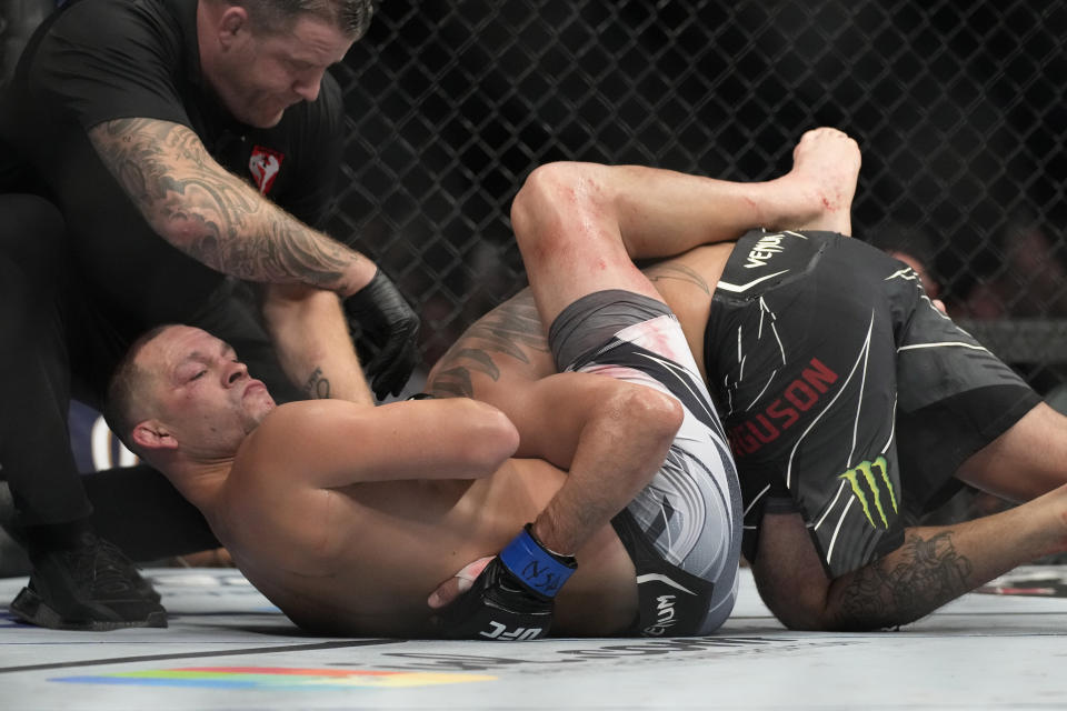 Nate Diaz, left, reacts after defeating Tony Ferguson in a lightweight bout during the UFC 279 mixed martial arts event Saturday, Sept. 10, 2022, in Las Vegas.  (AP Photo/John Locher)