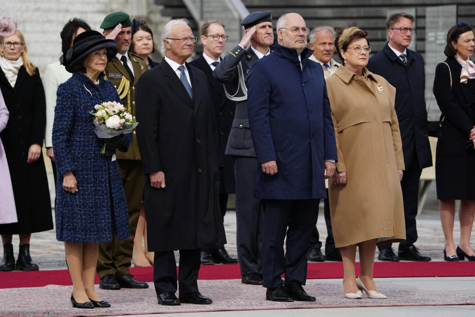 Sweden's King Carl XVI Gustaf, centre left, Queen Silvia, left, Estonian President Alar Karis, centre right and his wife Sirje Karis attend an official welcoming ceremony at Vabaduse (Freedom) square in Tallinn, Estonia, Tuesday, May 2, 2023. (AP Photo/Pavel Golovkin)