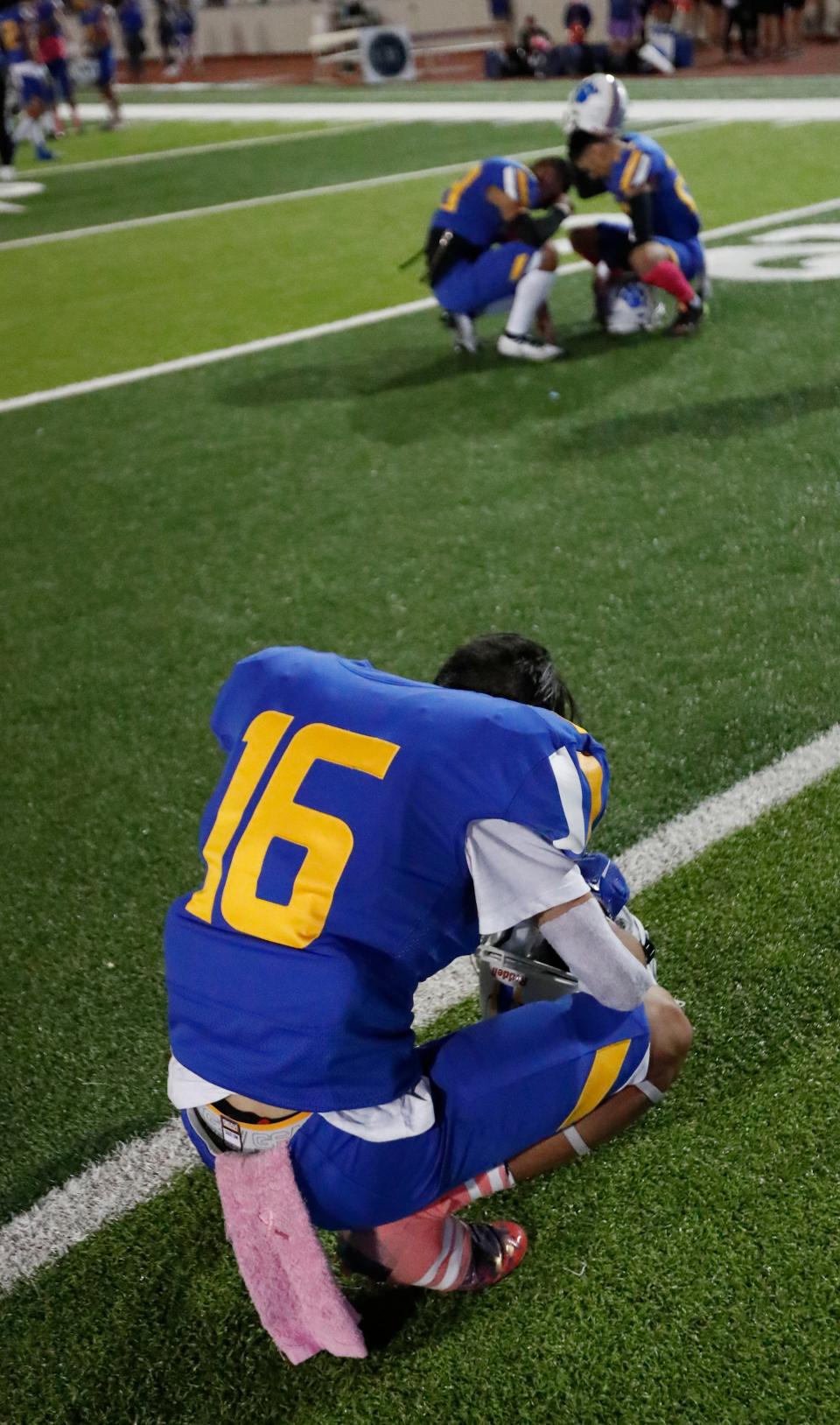 Frenship’s Jason Delagarza (16) kneels after the end of the game. Odessa Permian faces Frenship in a District 2-6A football game, Friday, Oct. 21, 2022, at Peoples Bank Stadium in Wolfforth.