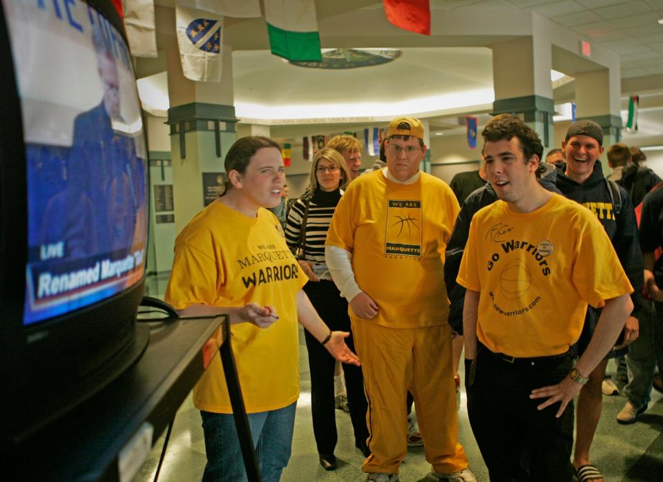 Marquette students show surprise, disappointment and laughter in the Marquette University Alumni Memorial Union as Father Wild makes the announcement on television of the name, "Gold."