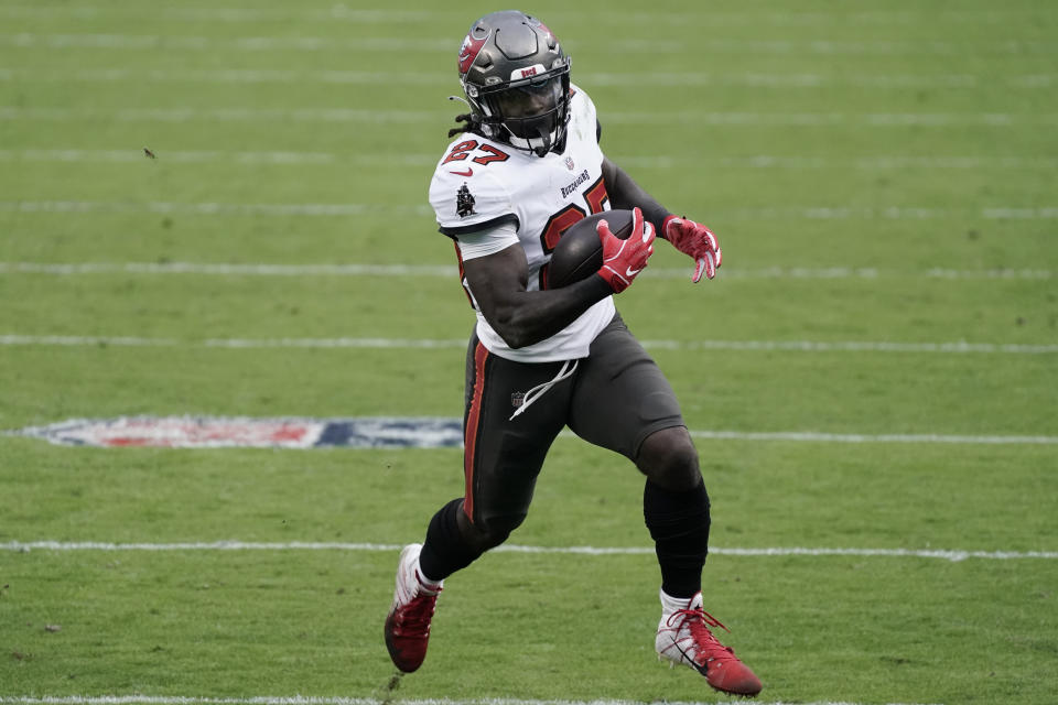 Tampa Bay Buccaneers running back Ronald Jones (27) runs against the Carolina Panthers during the second half of an NFL football game, Sunday, Nov. 15, 2020, in Charlotte , N.C. (AP Photo/Gerry Broome)