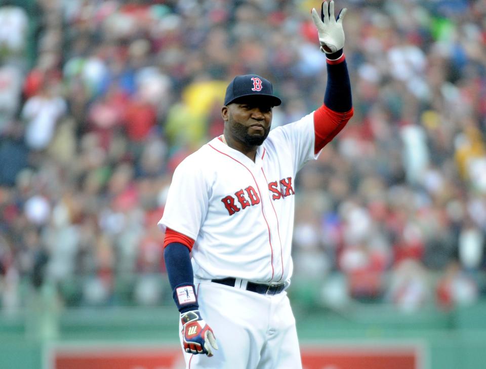 Red Sox designated hitter David Ortiz  acknowledges the crowd as part of pre game ceremonies in his honor.