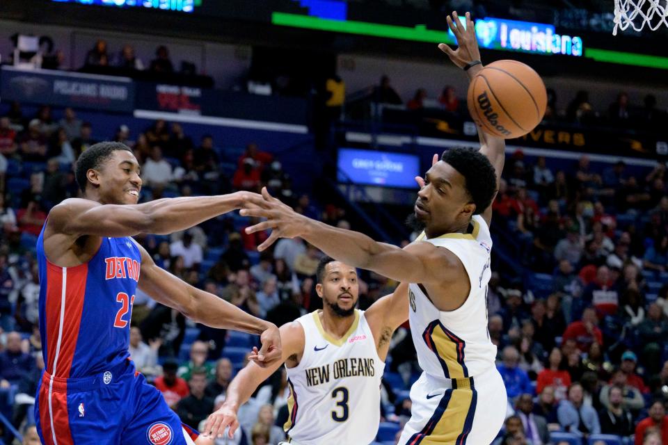 Detroit Pistons guard Jaden Ivey (23) passes the ball past New Orleans Pelicans forward Herbert Jones (5) during the first half at Smoothie King Center in New Orleans on Thursday, Nov. 2, 2023.