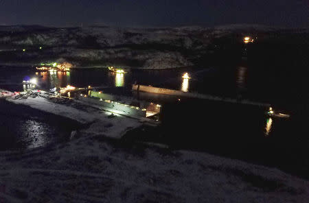 A view shows a shipyard following an incident, which involved the aircraft carrier Admiral Kuznetsov (not pictured) and a floating dock (R), in the town of Roslyakovo near Murmansk, Russia October 30, 2018. REUTERS/Stringer