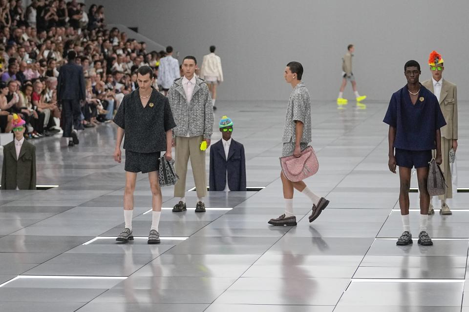 Models wear creations for the Dior Menswear Spring/Summer 2024 fashion collection presented in Paris, Friday, June 23, 2023. (AP Photo/Michel Euler)