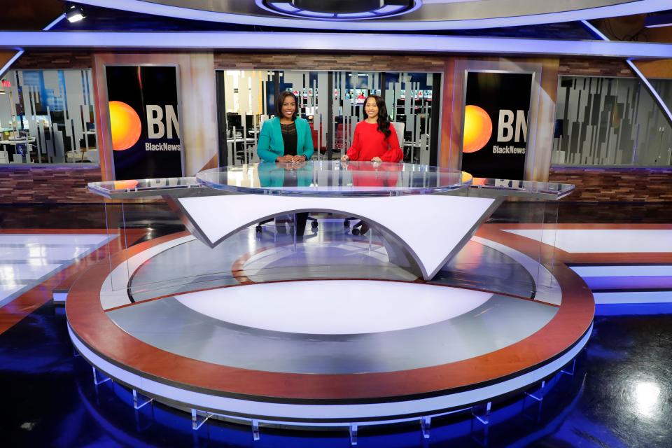 Black News Channel morning co-anchors Lauren McCoy, left and Rarione Maniece sit on set Tuesday, Jan. 7, 2020. 