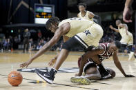 Vanderbilt forward Ejike Obinna, left, reaches for the ball over Texas A&M forward Jonathan Aku in the second half of an NCAA college basketball game Saturday, Jan. 11, 2020, in Nashville, Tenn. Texas A&M won 69-50. (AP Photo/Mark Humphrey)