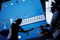 Wanderson Araujo (L) practices during his training session at a boxing school, in the Mare favela of Rio de Janeiro, Brazil, June 2, 2016. REUTERS/Nacho Doce