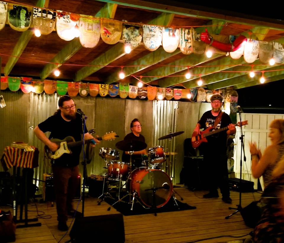 Damon Fowler, far left, is seen here performing with his namesake power trio at Birdrock Taco Shack in Bradenton’s Village of the Arts on March 3, 2023.