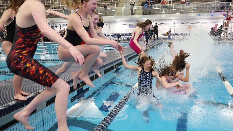 Olympus celebrates their 5A girls and boys state championship in Provo on Saturday, Feb. 24, 2024.