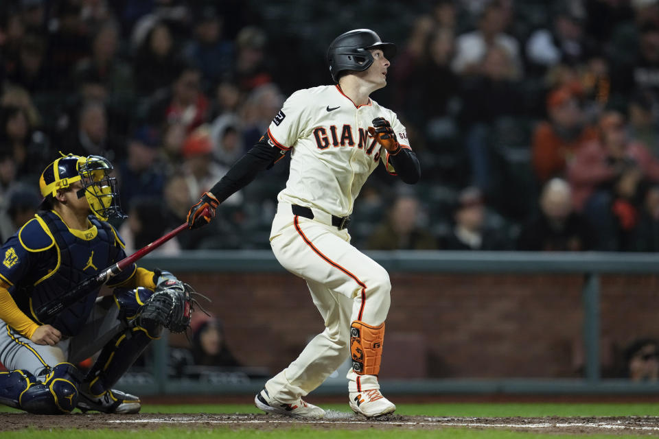 San Francisco Giants' Mike Yastrzemski watches his RBI double during the fourth inning of a baseball game against the Milwaukee Brewers, Wednesday, Sept. 11, 2024, in San Francisco. (AP Photo/Godofredo A. Vásquez)