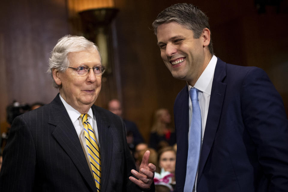 Sen. Mitch McConnell (R-Ky., left) chats with Justin Walker ahead of his Senate confirmation hearing. (Photo: Caroline Brehman via Getty Images)