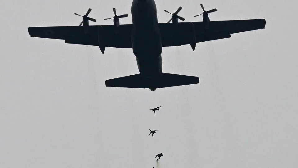 Pakistan Air Force paratroopers perform during a parade in Islamabad on March 23, 2024. (Aamir Qureshi/AFP via Getty Images)