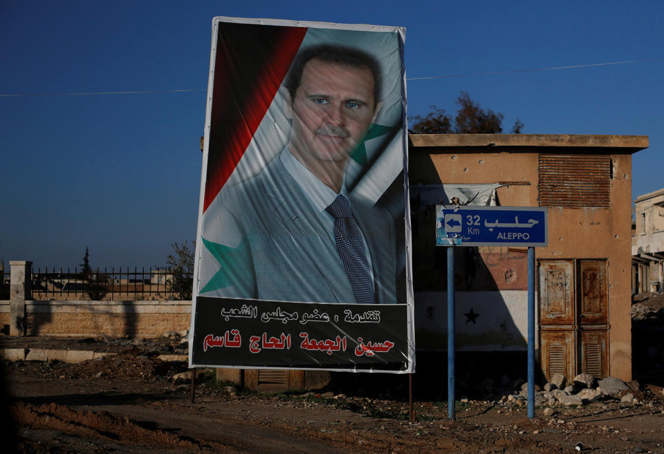 Syria’s President Bashar al-Assad picture is seen in Ramouseh