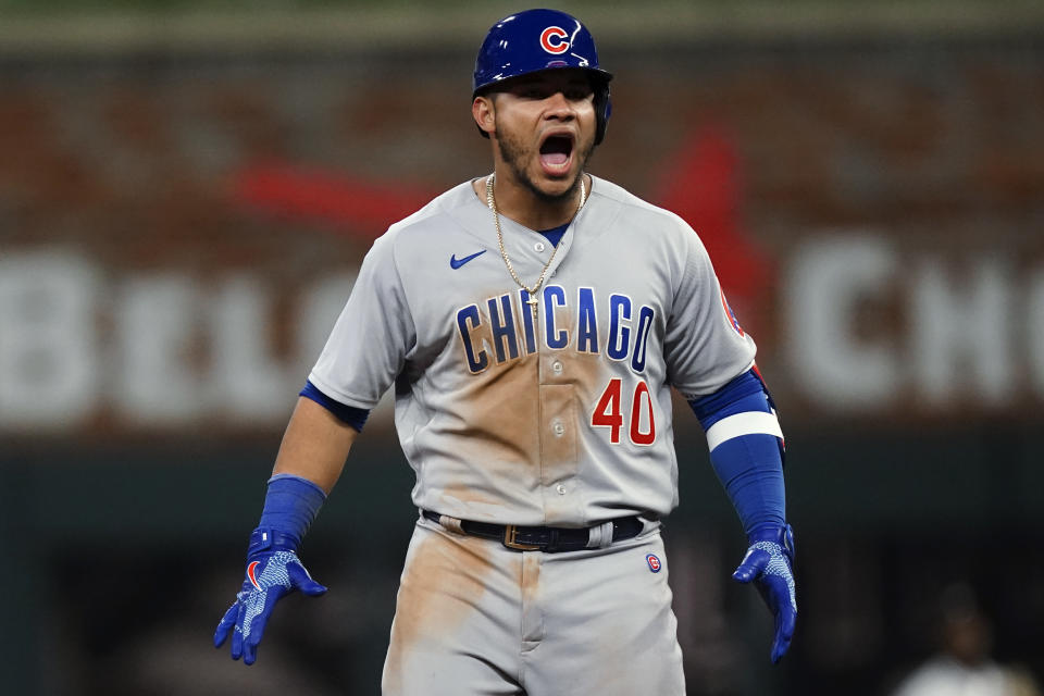 Chicago Cubs catcher Willson Contreras reacts after driving in the go-ahead run with a double in the 10th inning of the team's baseball game against the Atlanta Braves on Wednesday, April 27, 2022, in Atlanta. (AP Photo/John Bazemore)