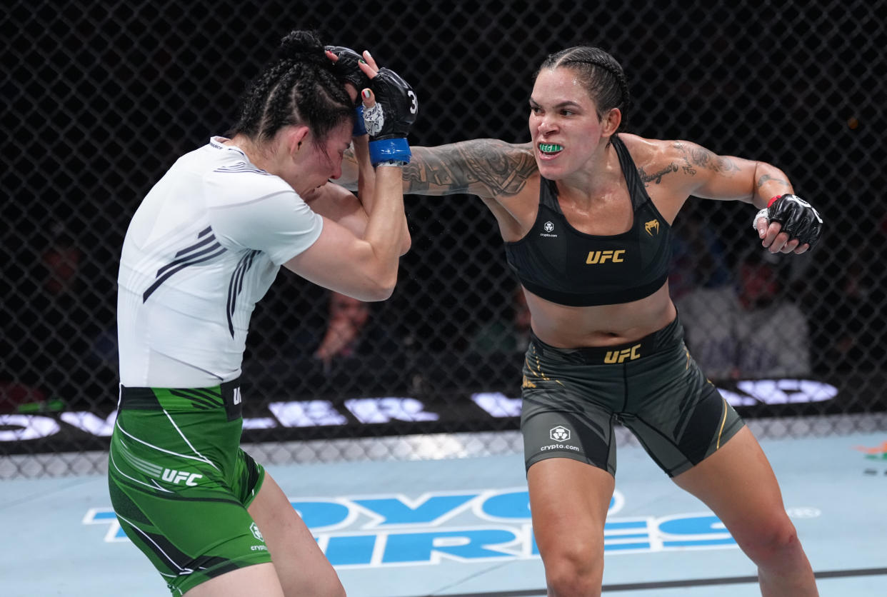 VANCOUVER, BRITISH COLUMBIA - JUNE 10:  (R-L) Amanda Nunes of Brazil punches Irene Aldana of Mexico in their women's bantamweight title fight during the UFC 289 event at Rogers Arena on June 10, 2023 in Vancouver, Canada. (Photo by Jeff Bottari/Zuffa LLC)