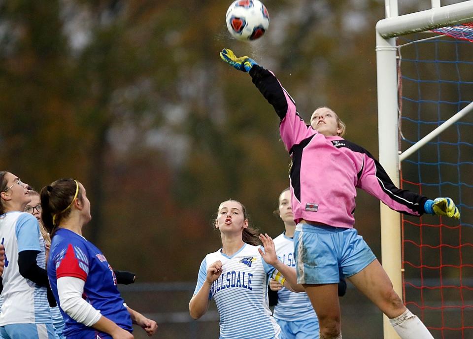 Hillsdale High School’s keeper Kori Vesper leaps to knock a Mapleton High School corner kick over the cross bar during high school girls soccer action at Mapleton’s John E. Camp Stadium on Monday, Oct. 19, 2020. TOM E. PUSKAR/TIMES-GAZETTE.COM