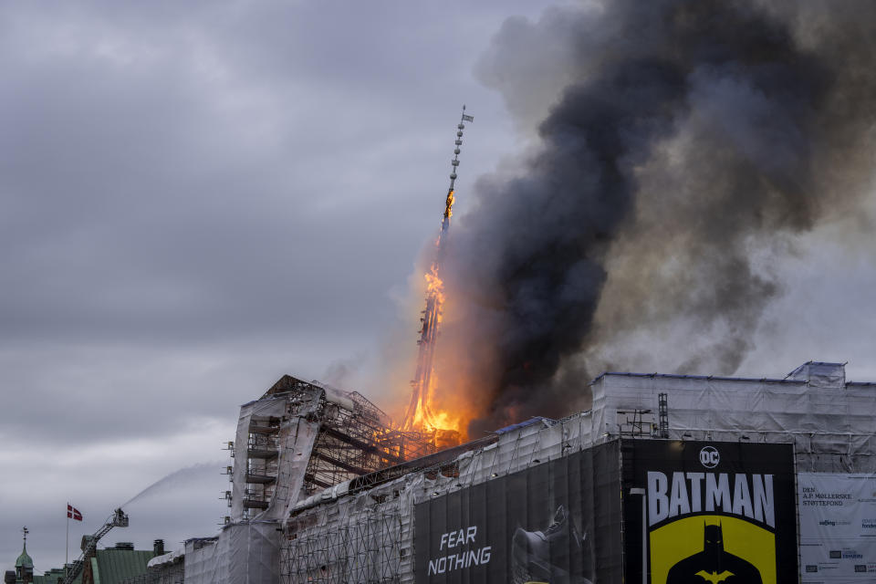 Fire and smoke rise out of the Old Stock Exchange, Boersen, in Copenhagen, Denmark, Tuesday, April 16, 2024. One of Copenhagen’s oldest buildings is on fire and its iconic spire has collapsed. The copper roof of the 17th-century Old Stock Exchange, or Boersen, that was once Denmark’s financial center, was engulfed in flames Tuesday. (Ida Marie Odgaard/Ritzau Scanpix via AP)