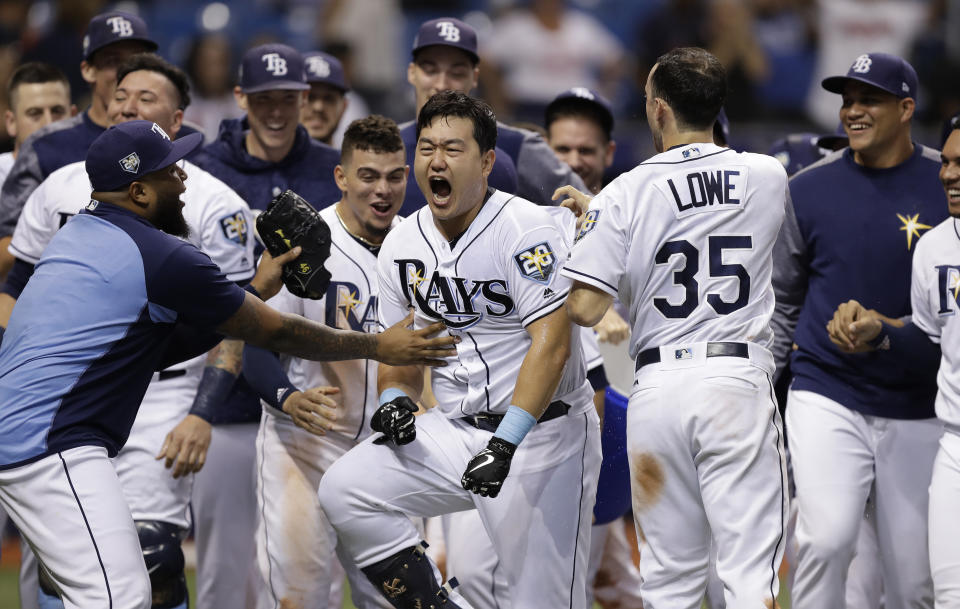 Tampa Bay Rays’ Ji-Man Choi, of South Korea, center, celebrates his two-run walk-off home run off Cleveland Indians pitcher Brad Hand during the ninth inning of a baseball game Monday, Sept. 10, 2018, in St. Petersburg, Fla. (AP Photo/Chris O’Meara)