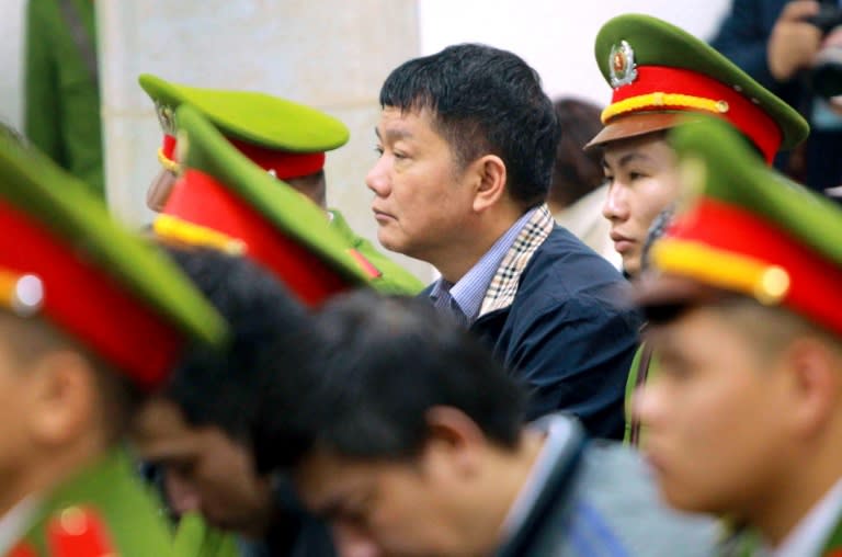 Former Politburo member Dinh La Thang (C), who once chaired the board of PetroVietnam, was sentenced to 13 years in the highest-profile corruption trial to target the country's business and political elite