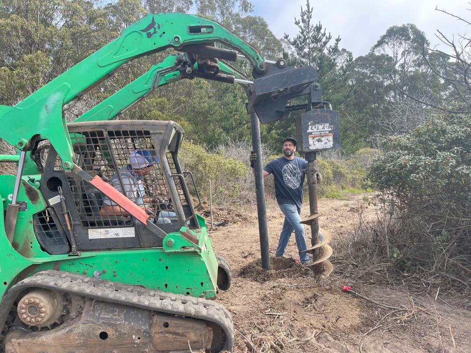 Mark Matzeldelaflor, founder of Guardian Grange, working on the fence at Orville Schell Farms in Bolinas, California.