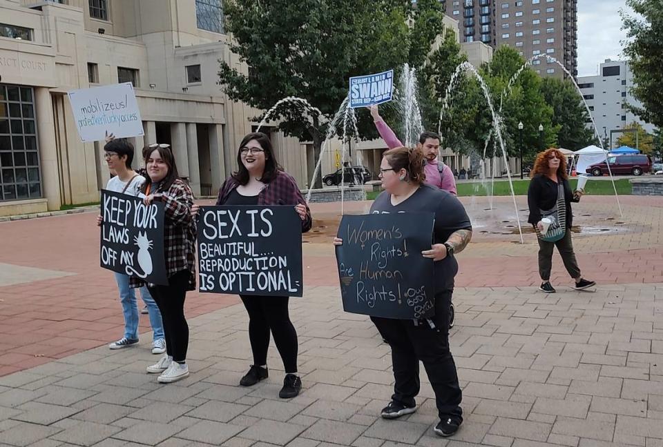 The Rally For Your Rights drew several dozen people to the courthouse plaza in downtown Lexington Friday evening. Speakers included a number of Kentucky political candidates who voiced their support for abortion rights.