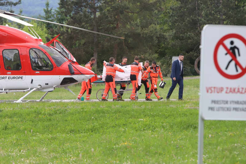 Rescue workers carry the shot and injured Slovakian Prime Minister Robert Fico on a stretcher to hospital. Jan Kroslák/TASR/dpa