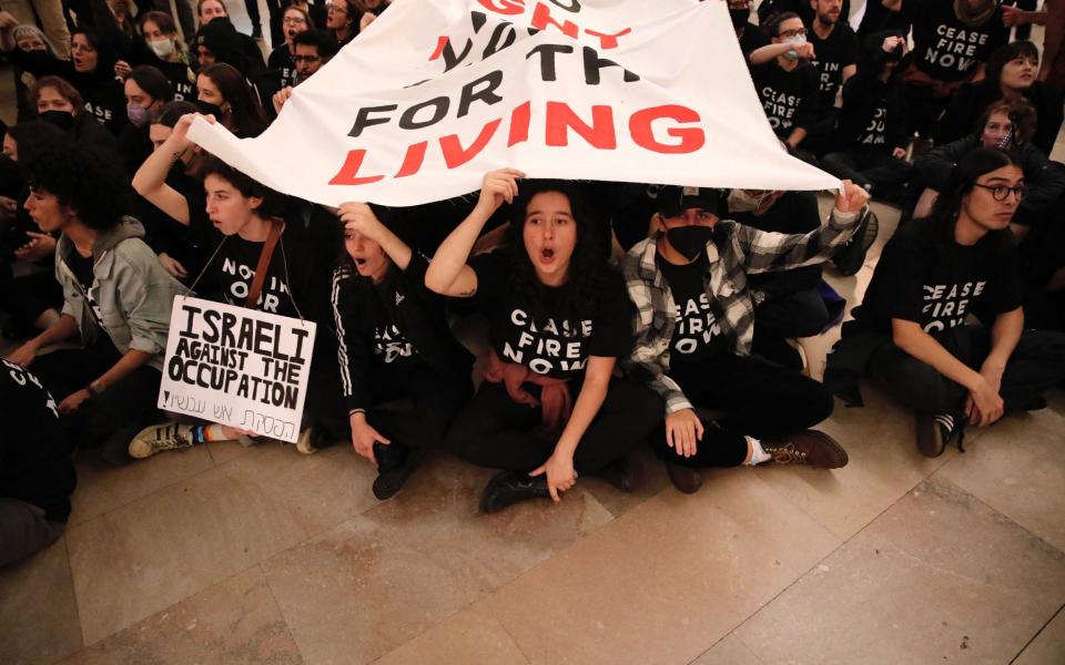 People demonstrate calling for a cease-fire amid war between Israel and Hamas, at Grand Central Station in New York City