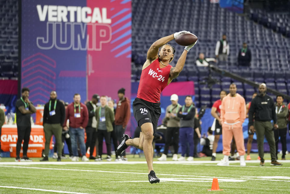 FILE - Princeton wide receiver Andrei Iosivas runs a drill at the NFL football scouting combine in Indianapolis, Saturday, March 4, 2023. Andrei Iosivas, Shepherd University's Tyson Bagent and Caleb Murphy of Ferris State are all trying to break out of their small-school roots to prove they should be selected on draft weekend. (AP Photo/Michael Conroy, File)