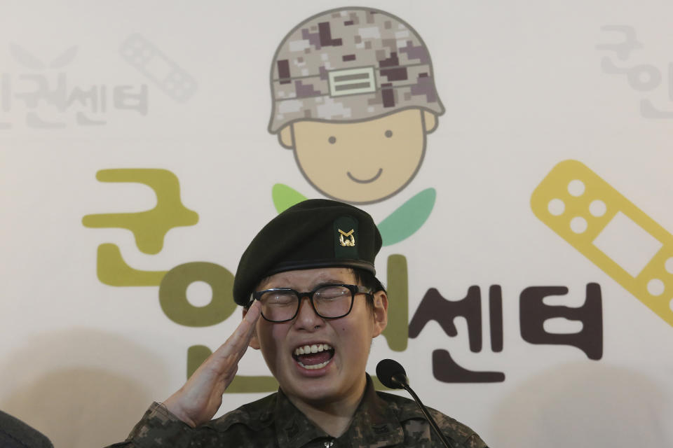 FILE - In this Jan. 22, 2020, file photo, South Korean army Sergeant Byun Hui-su salutes during a press conference at the Center for Military Human Right Korea in Seoul, South Korea. South Korea’s military said Thursday, Oct. 21, 2021 it will appeal a landmark court ruling that struck down its decision to discharge the country’s first known transgender soldier before she was found dead earlier this year. The sign reads: "The Center for Military Human Right Korea." (AP Photo/Ahn Young-joon, File)