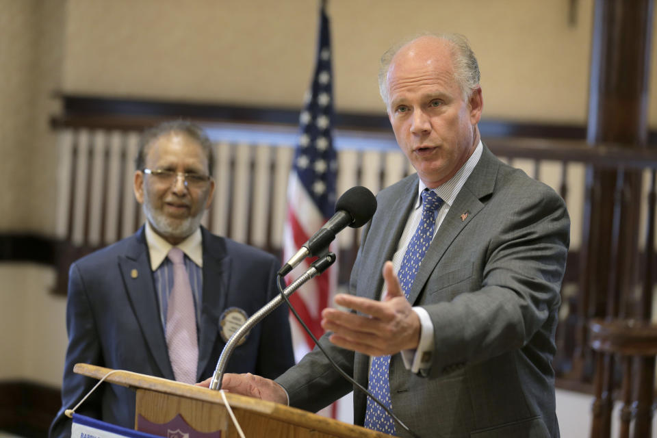 In this Oct. 2, 2018 photo, Rep. Dan Donovan, R-NY, talks to members of the Rotary Club in the Staten Island borough of New York. Donovan is running for reelection in the Nov. 6, 2018 mid-term election against Max Rose, a Democratic challenger who positions himself as a moderate. (AP Photo/Seth Wenig)