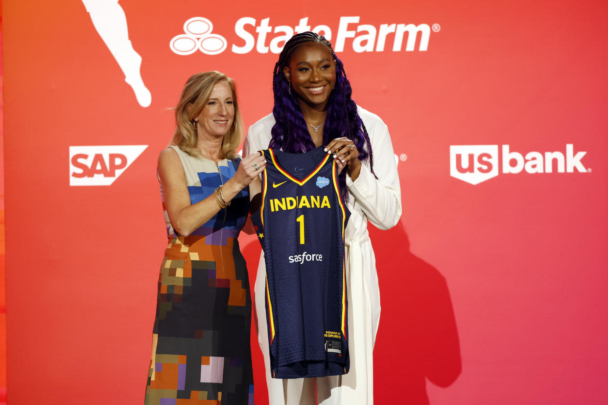 Aliyah Boston (right) holds up an Indiana Fever jersey alongside WNBA Commissioner Cathy Engelbert after Boston was drafted first overall by the Fever in the 2023 WNBA Draft on Monday in New York. (Photo by Sarah Stier/Getty Images)